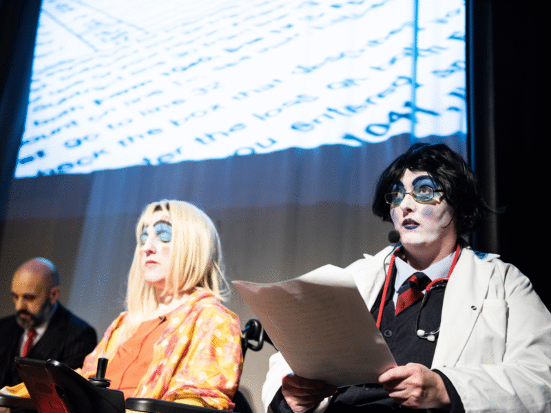 http://Two%20performers%20in%20dramatic,%20expressive%20makeup%20perform%20'Assessment%20II'